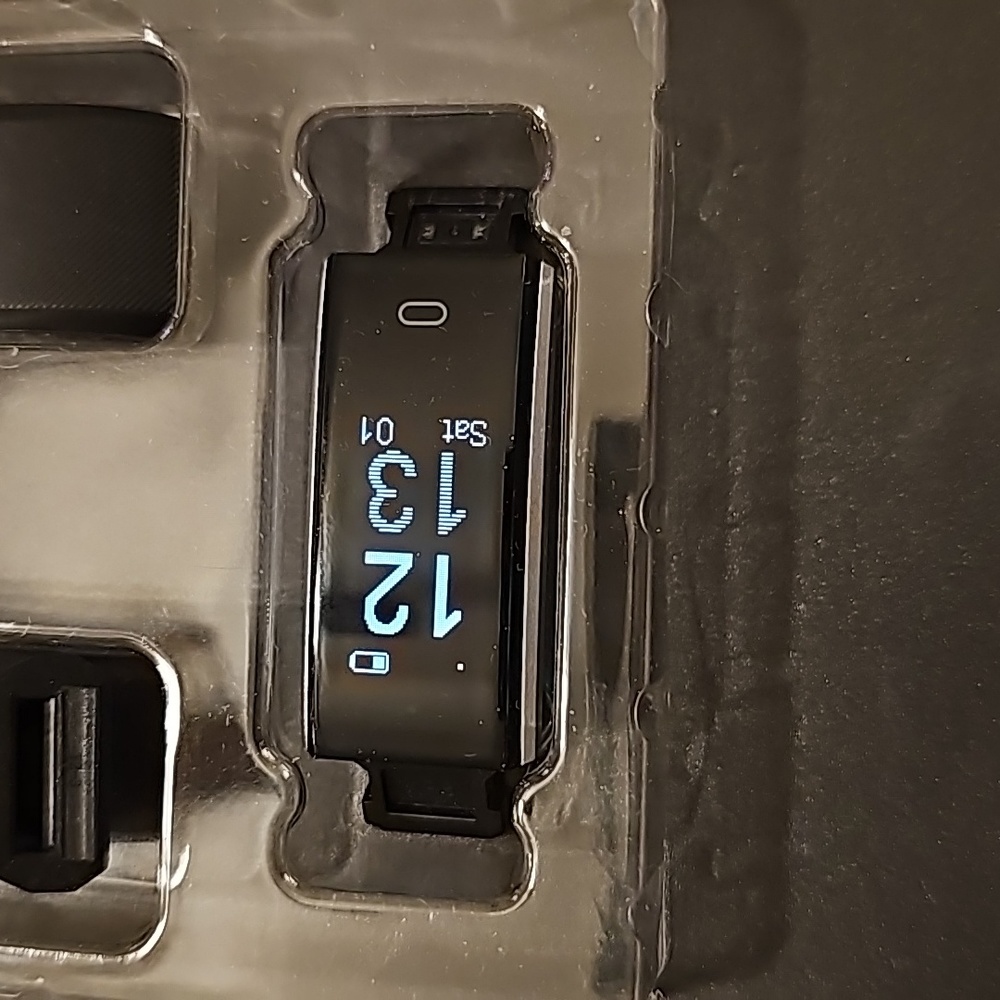 Letscom fitness tracker. New in box never been used. Charges in USB port.